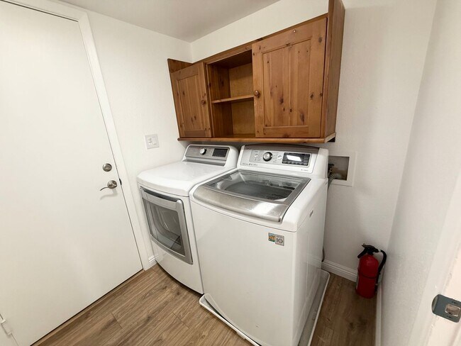 Building Photo - Corner Lot Beauty with Open Living, Guest Suite Down & Expansive Backyard