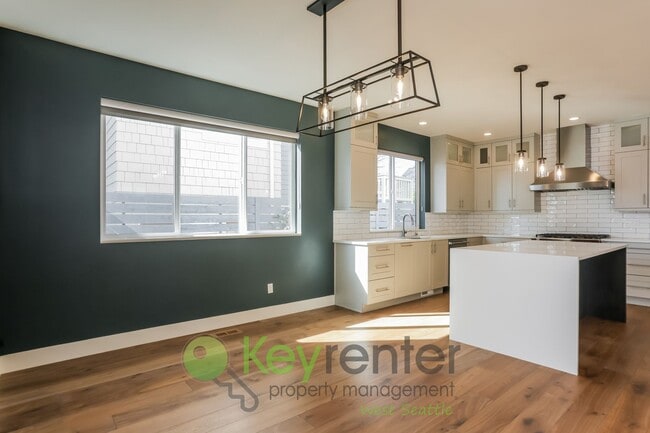 Building Photo - Spacious Living with Balconies, Deck, and Private Yard