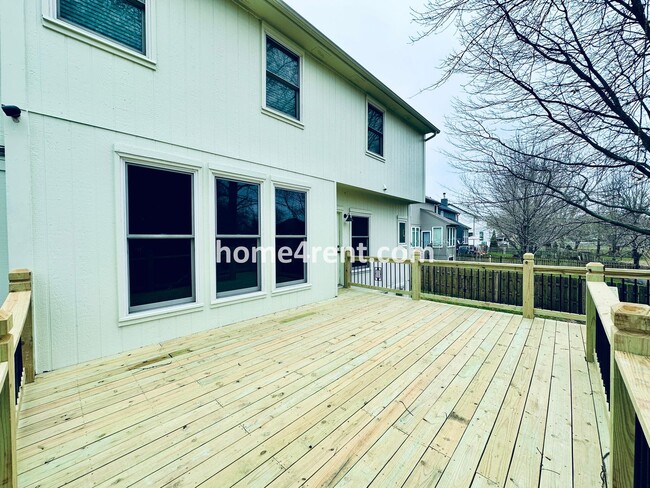 Building Photo - Blue Valley Schools w/ Wood Floors, Finished Basement and a Peaceful, Private Fenced Yard!