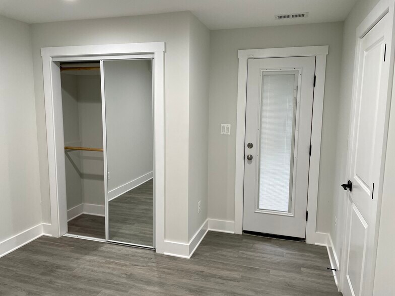 Bedroom with closet and rear door - 731 Girard St NW