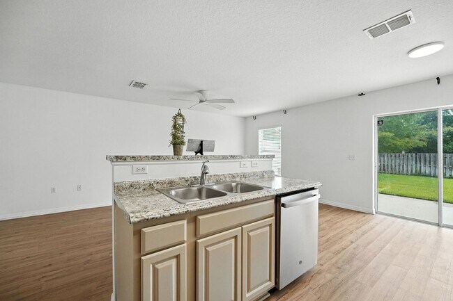 Building Photo - 32218 Gem: Open-Concept Townhome Minutes from the Airport