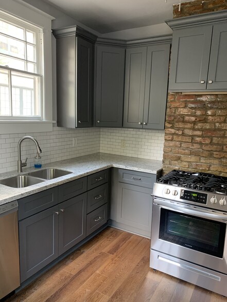 Updated kitchen with granite counters and stainless appliances - 1215 Foucher St