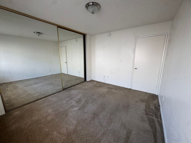 Building Photo - $2,395! Spacious Upstairs 2 Bedroom, 2 Bathroom Apartment with 2-Car Garage! 90710