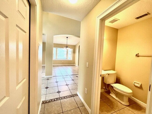 Building Photo - EAGLE CREEK LAKE NONA! WELCOME HOME! Beautiful water views! Spacious 2 story-3 bedroom 2.5 bath h...