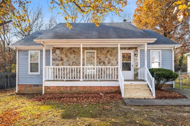 Building Photo - NE Home - Updated Kitchen and Bathrooms! SS Appliances, Fire Place, Front Porch & Deck, Fenced Yard!