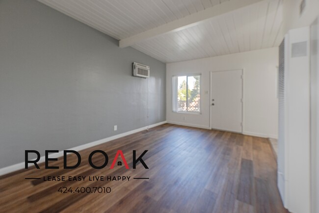 Building Photo - Bright and Spacious One-Bedroom with A/C, ...