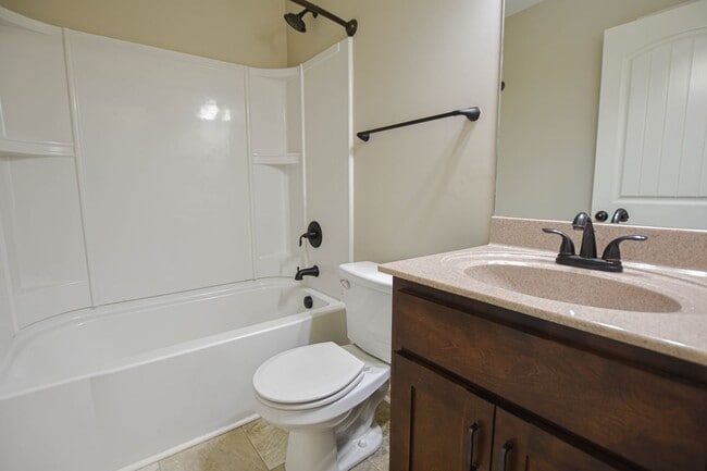 Building Photo - Pet Friendly Three Bedroom with Bonus!