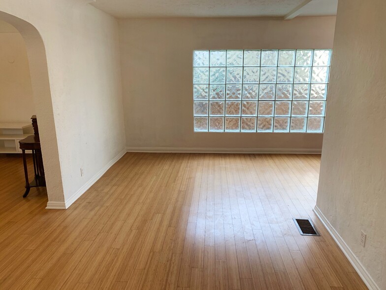 Windows and glass wall provide great natural lighting - 1226 S Highland Ave