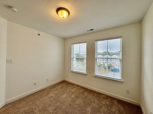 Building Photo - Practically New & Available NOW! Americana Luxury Townhomes! Pet Friendly! Attached Garage! All A...