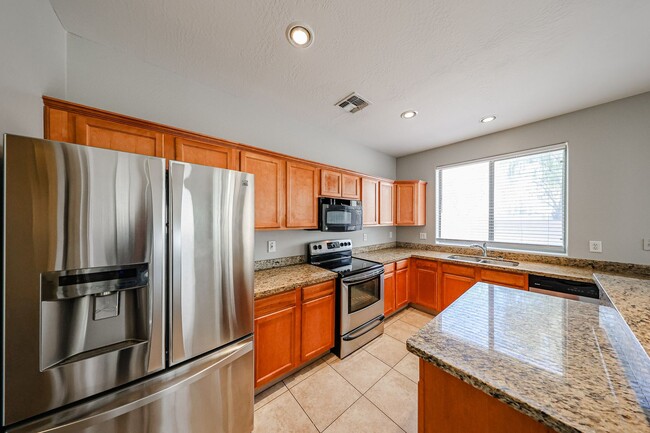 Building Photo - Welcome to this spacious 4 bedroom, 2.5 ba...