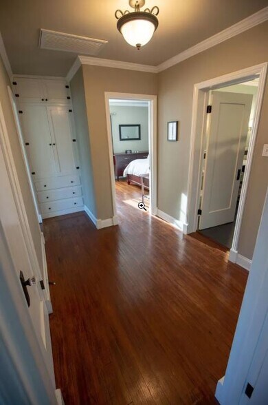 Hall connecting kitchen, bedrooms, bathroom, dining, giant closet and built-in storage. - 1327 S Sycamore Ave