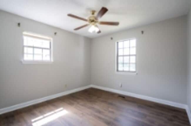 Building Photo - This beautifully updated brick home in Har...