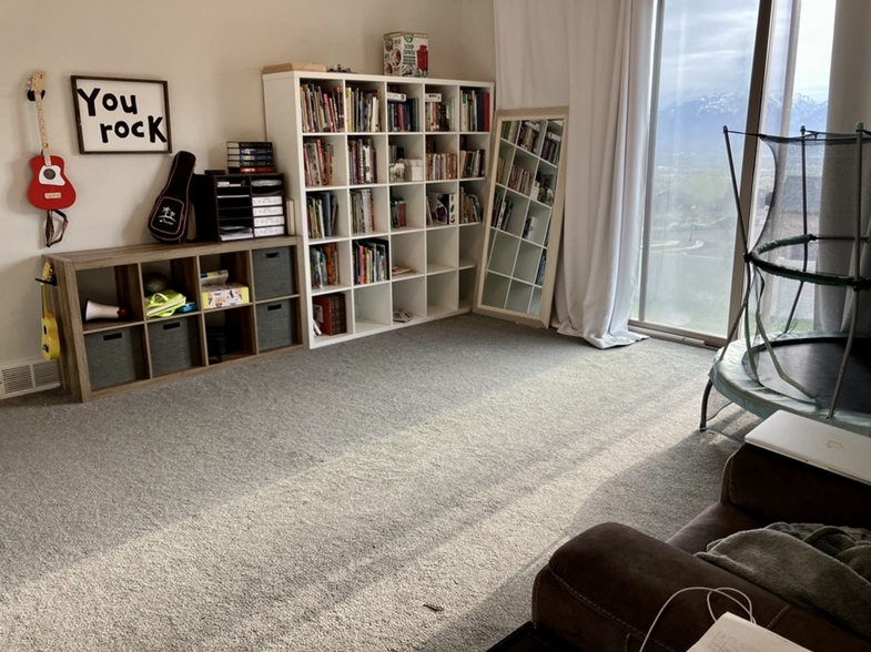 Primary bedroom is very large and is currently used as a playroom; ft. sliding doors to the backyard - 14487 S Cuchara Way