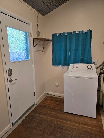 Laundry room with exterior door to backyard - 607 Harrison Ave