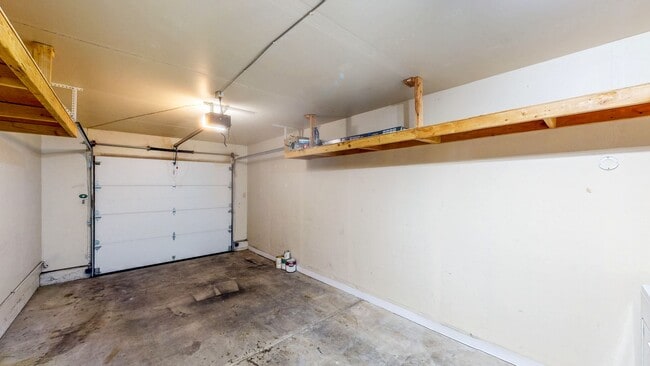 Building Photo - Cozy 1 bedroom 1 bath end unit condo with 1 car garage and private patio located next to Peterson...