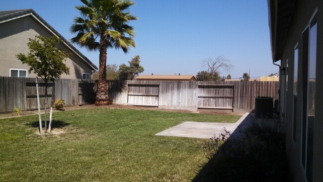 Building Photo - REDUCED!! Large Corner Lot Home with Landscaping included!