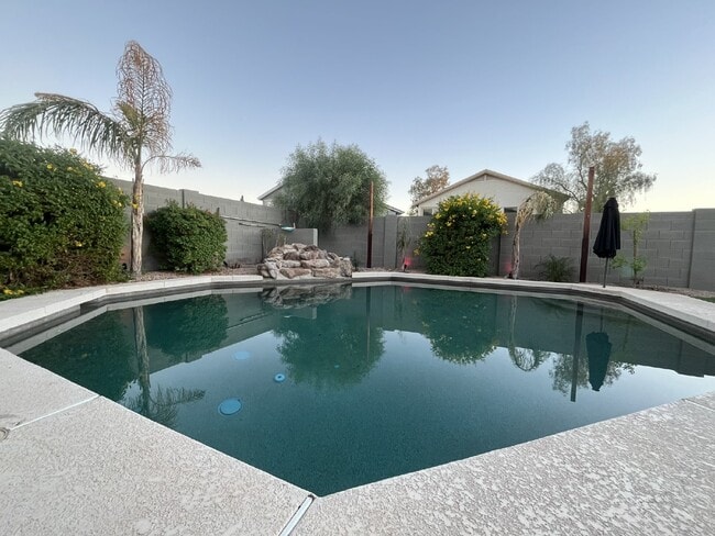 Building Photo - "Charming 4-Bed Oasis with Granite Touch & a Beautiful Pool"