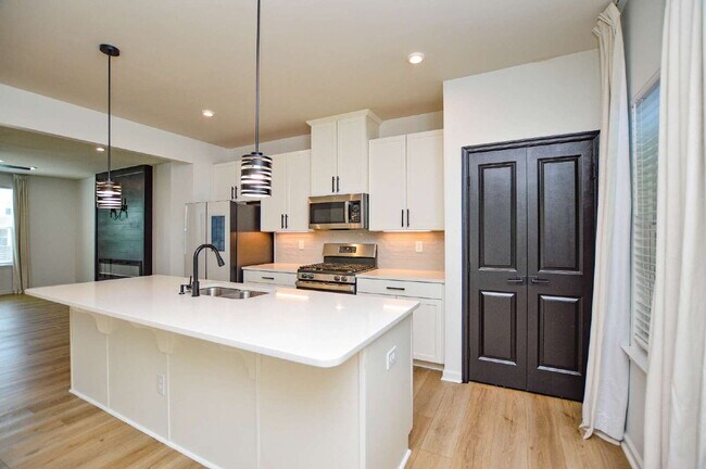 Building Photo - 3 Bedrooms | 2.5 Bathrooms | Lower-Level Flex Room | Approximately 1,978 Square Feet | 2-Car Gara...