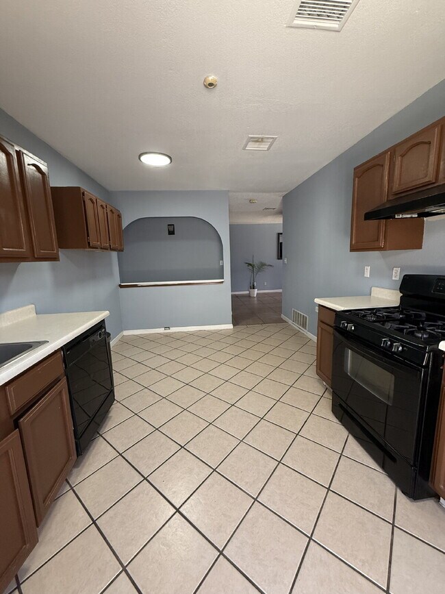 Building Photo - Well, kept three-bedroom, two baths home with Solar Panels. A must see, lease today! 11797 Imperi...