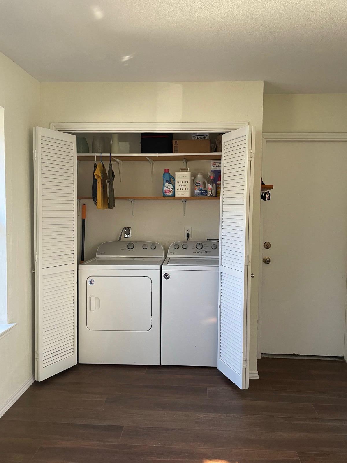 In-unit laundry with washer, dryer, and storage shelving included. - 2401 Thistle Ct
