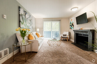 Kent Apartments - Vibe Apartments - Living Room, Deck, and Fireplace - Vibe