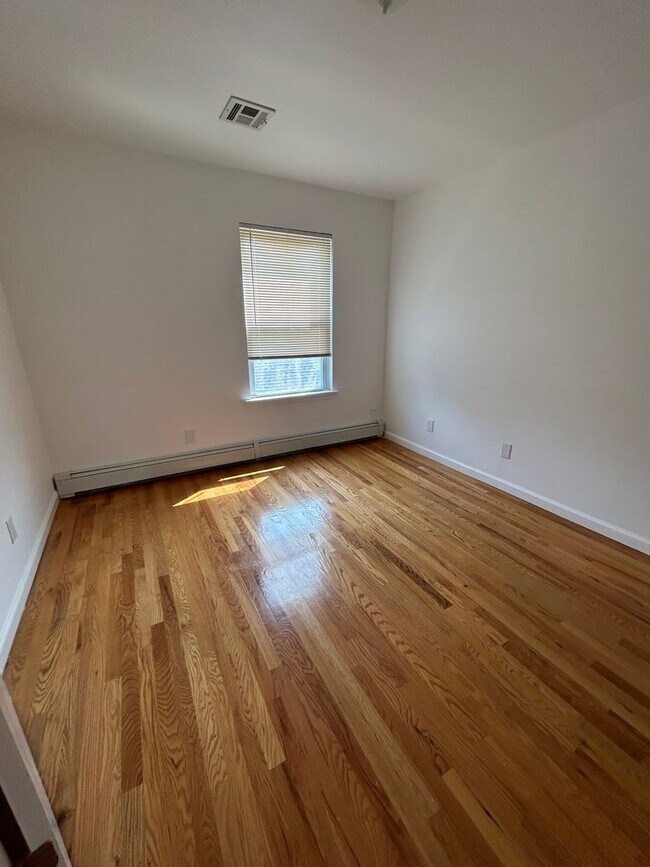Building Photo - Discover Your Dream Home in Neptune: Spacious 4-Bedroom, 2.5-Bath with Private Backyard and Drive...