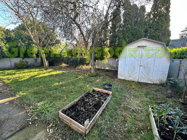 Building Photo - Huge, fenced back yard! Garage! Nice bonus...