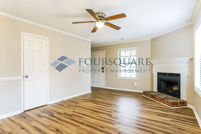 Building Photo - Inviting 2-Bed Townhome with Front Porch, Private Parking  & Storage