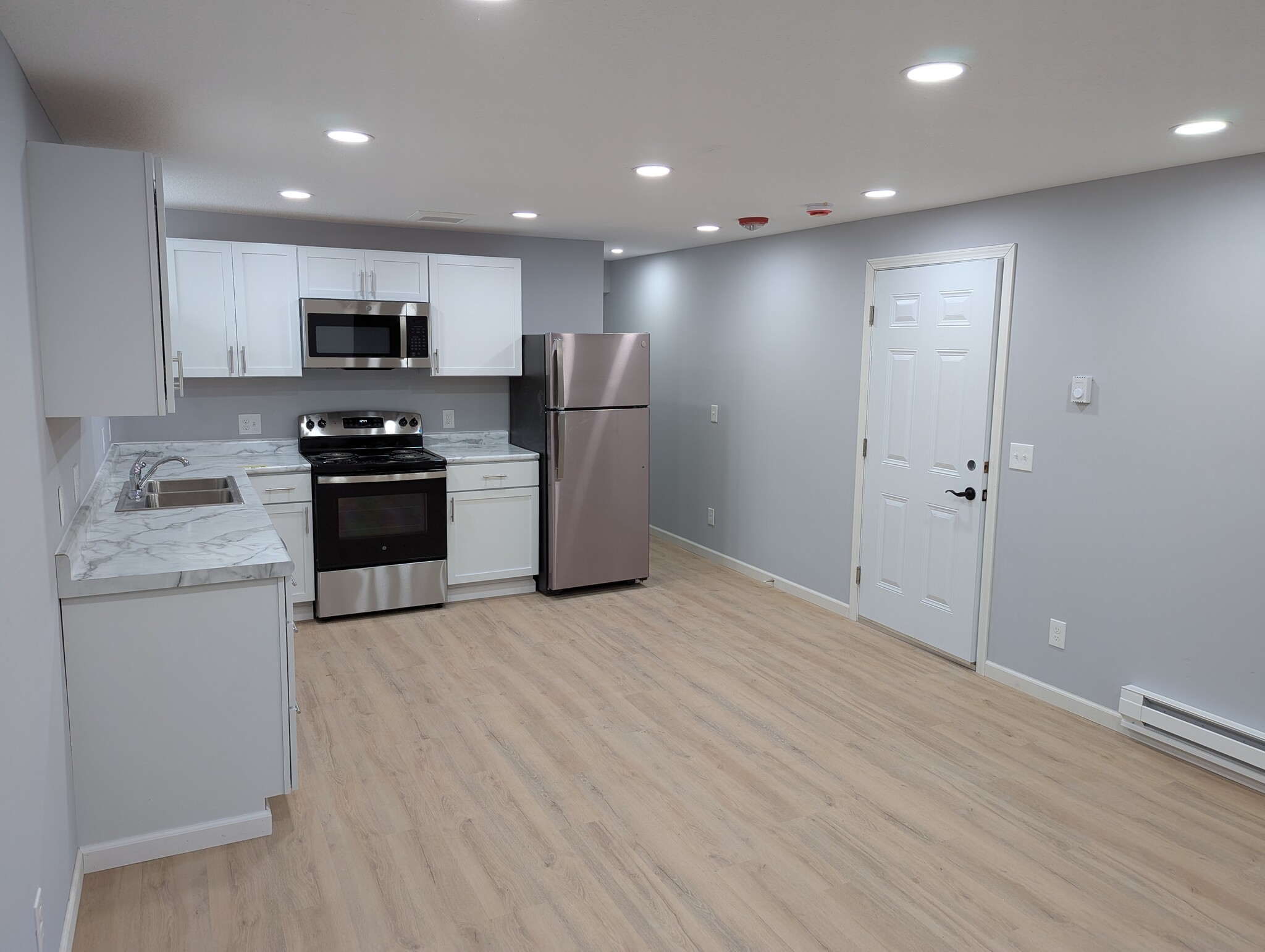 kitchen, entry door and hallway to bathroom - 203 3rd St E