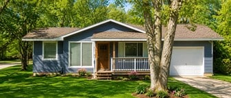 Bright and welcoming living room inside this pet-friendly 2-bedroom single-family home for rent in W - 1220 S 12th Ave