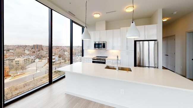 Stunning modern kitchen with custom cabinetry and plenty of space for cooking and entertaining - Modera West Wash Park