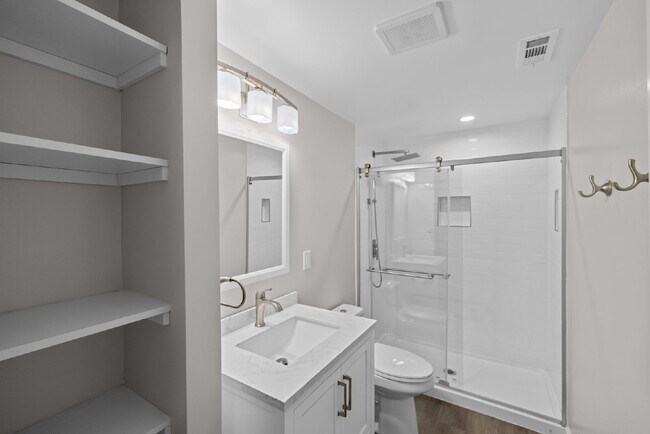Building Photo - Completely Renovated Corner Townhome with Modern Kitchen, Designer Baths, and Private Yard