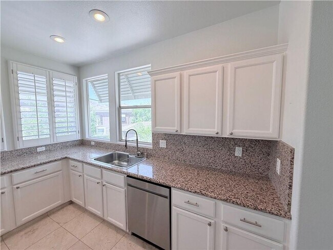 Building Photo - Amazing condominium in gated upscale neigh...