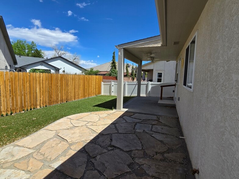 Backyard covered area off backdoor and flagstone patio - 726 W Tyrolean Ct
