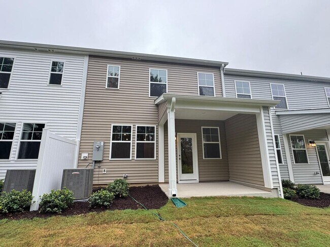 Building Photo - STUNNING BRAND-NEW TOWNHOUSE in a very con...