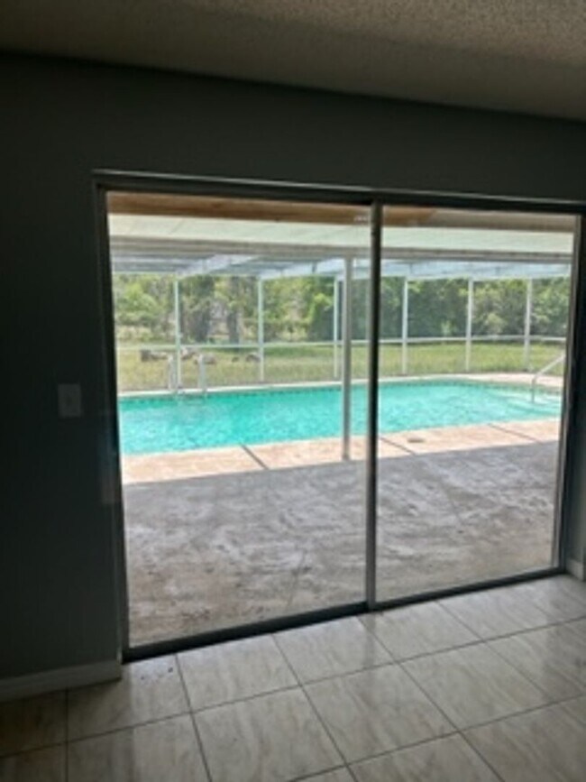 Building Photo - Large  3 bedroom, 2 bath pool home.