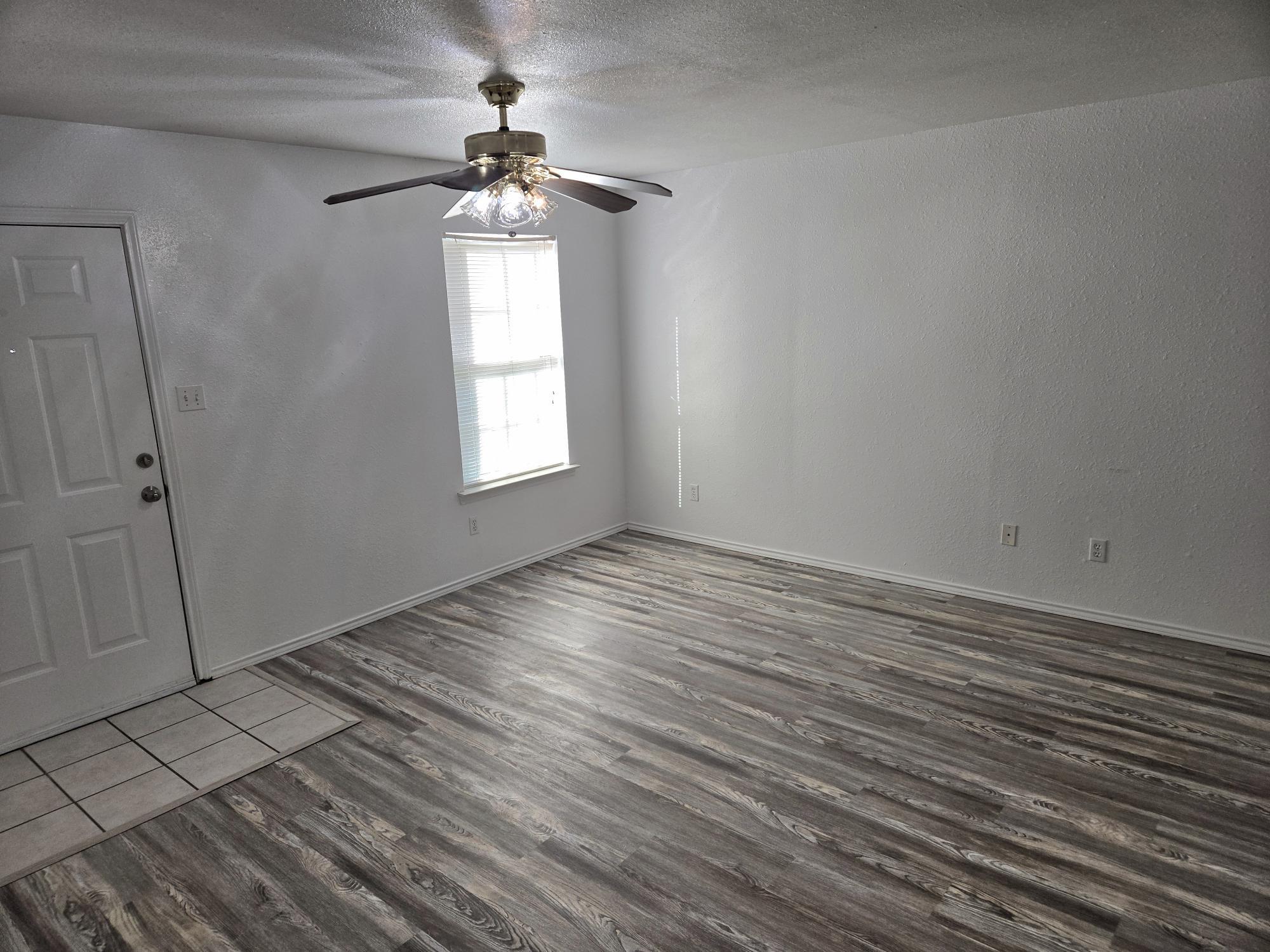 UNIT E, living room and entry - 605 College St