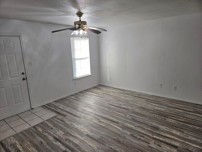 UNIT E, living room and entry - 605 College St