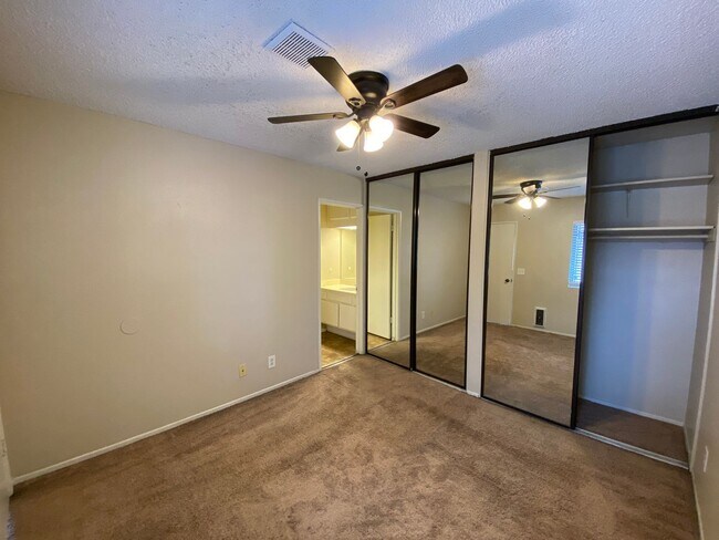 Building Photo - 2 BR 2 BA Corner Condo w/Balcony W/D Gated Entry Carport + Space