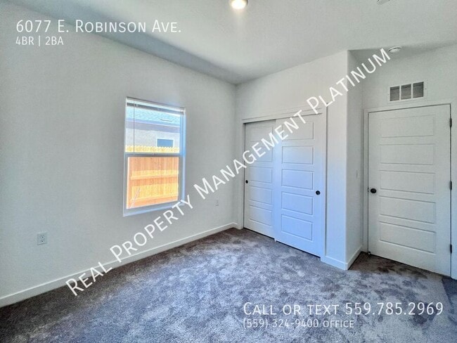 Building Photo - 6077 E Robinson Ave