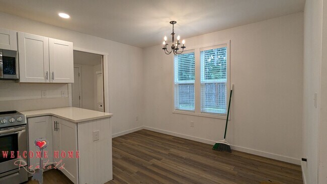 Building Photo - 4 bedroom home with air conditioning - Great location!!!  HUGE basement for your man cave or she ...