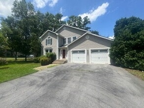 Building Photo - Free Application Fee — Refunded Upon Approval Through August 31! Spacious 4BR Home + Fenced Backy...
