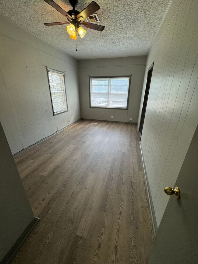 Building Photo - Three bedroom two bath home with central heat and air, large fenced backyard, and carport!