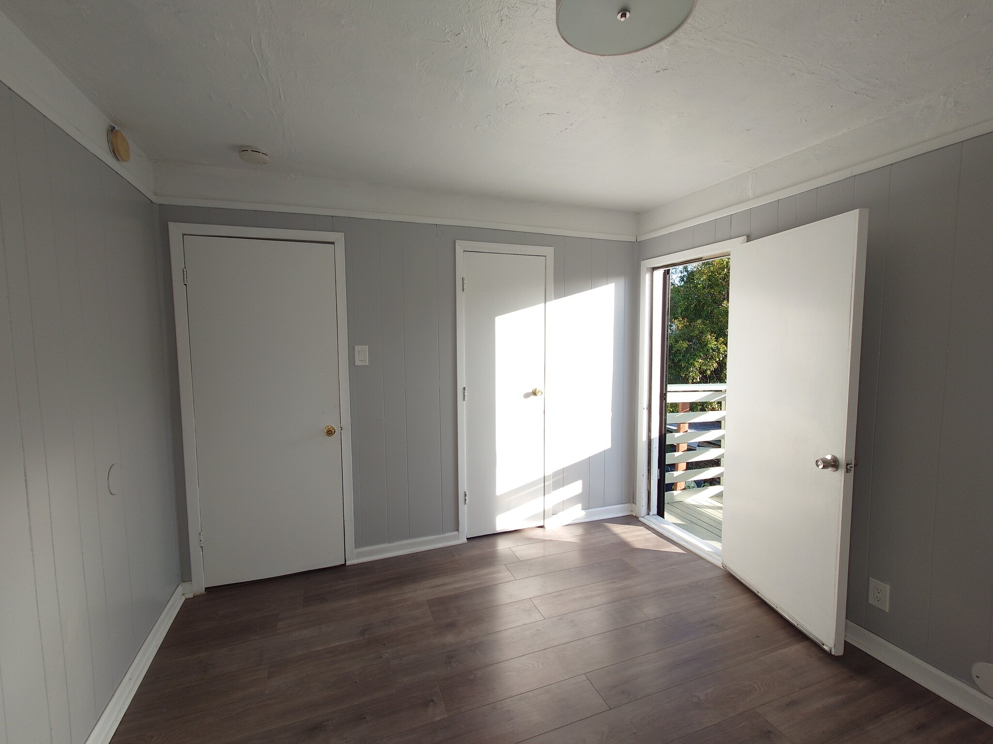 master bedroom with balcony entrance and closet - 1474 7th St