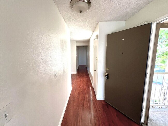 Building Photo - 2 Bedroom, 2 Bath Upstairs Condo with Private Balcony & 2-Car Garage, Gated Community, Water/Tras...