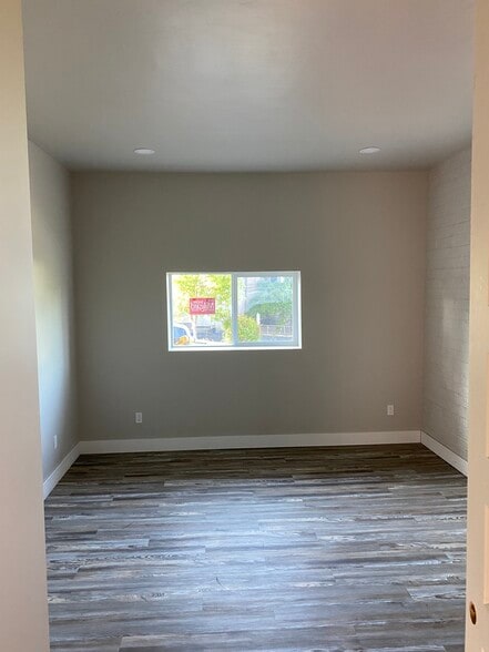 Master bedroom with 10 ft walls, Luxury Vinyl Plank Flooring. - 225 2nd St