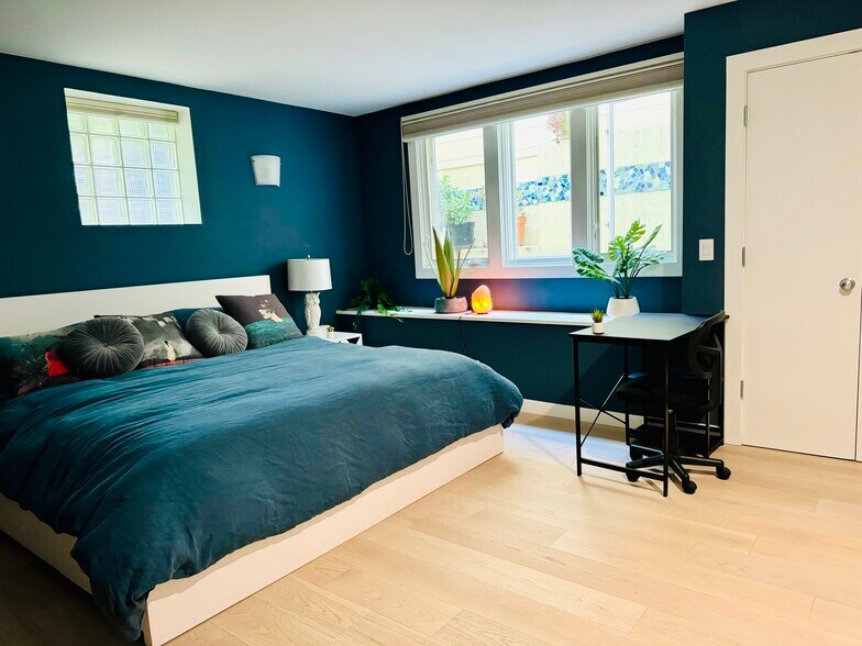 Large main bedroom with walk-in closet, black-out blinds, and large window seat - 328 Harriet St