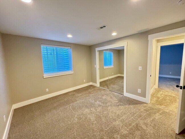 Building Photo - 4 BEDROOM, 3 BATHROOM TWINHOME WITH 2 CAR ATTACHED GARAGE IN NORTH CHEYENNE