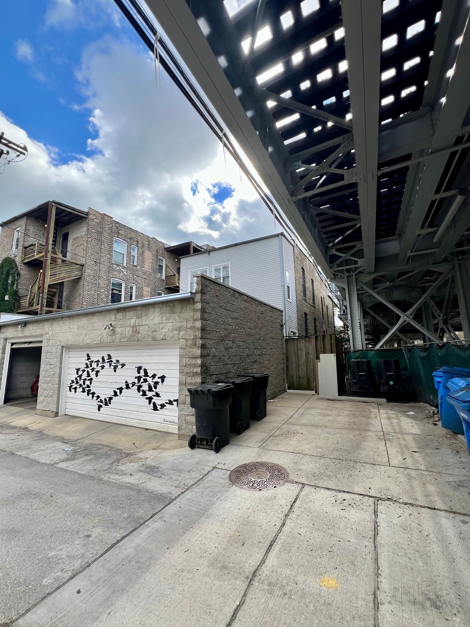 One indoor car space in the garage and second space on parking pad beside garage - 938 W Newport Ave