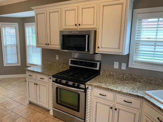 Building Photo - Luxury Living! Beautiful Brick Home in Sango with 3 car garage.